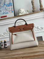 HERBAG ZIP 31 LAQUERED BAG IN OFF-WHITE MIX BROWN H PLUME CANVAS AND BROWN COWHIDE
