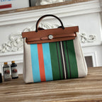 HERBAG ZIP 31 LAQUERED BAG IN GREEN MIX BLUE H PLUME CANVAS