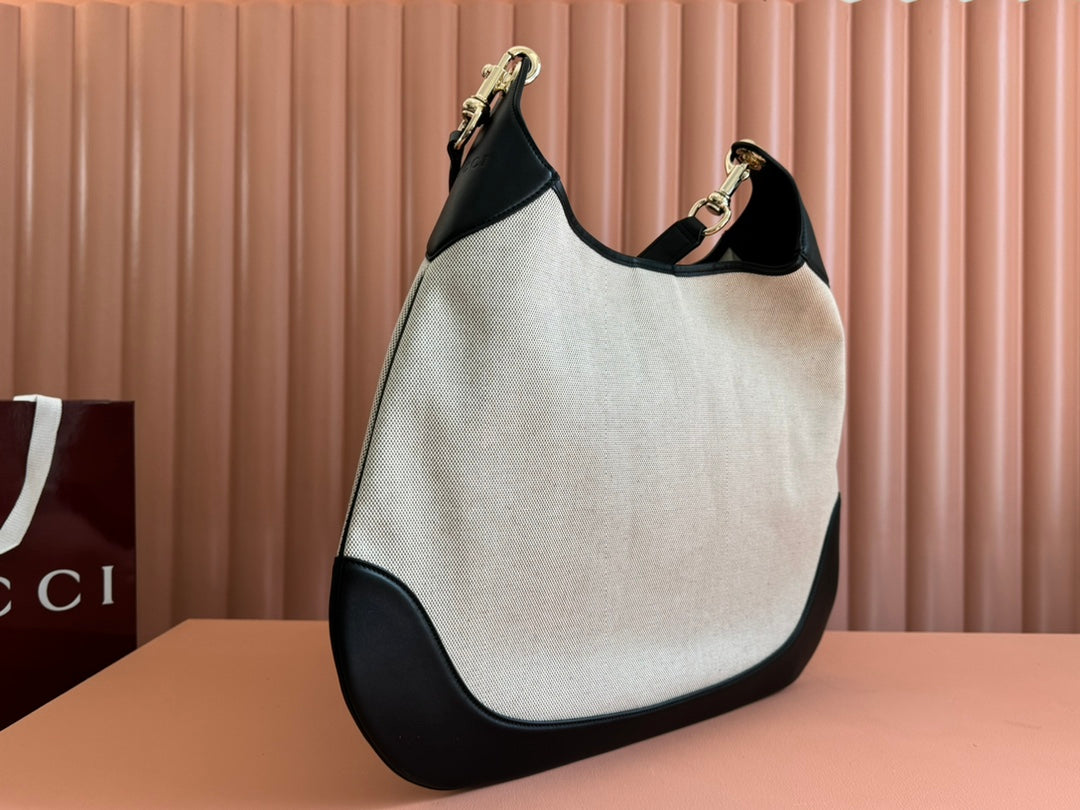 BODY MEDIUM SHOULDER BAD 49 IN NATURAL CANVAS AND BLACK CALFLEDER GOLD HARDWARE