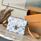 POCHETTE MÉTIS 25 IN LAGOON BLUE MONOGRAM TILES CANVAS GOLD HARDWARE