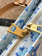 ONTHEGO EAST WEST 25 IN LAGOON BLUE MONOGRAM TILES CANVAS