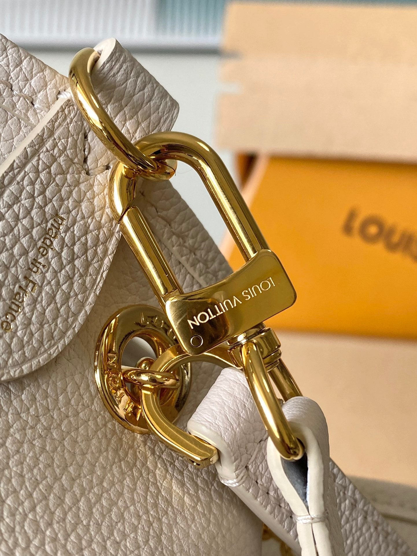 Bundle 28 in Weiß-Orange Monogramm Empreinte Leder Gold Hardware