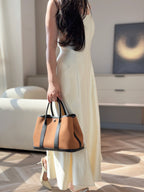 GARDEN PARTY 30CM IN ORANGE MINIMUM TOILETS COTTON CANVAS AND BLACK CALFSKIN