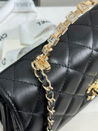 Klapptasche 18 mit Griff aus schwarzem Kalbsleder mit goldenen Beschlägen 