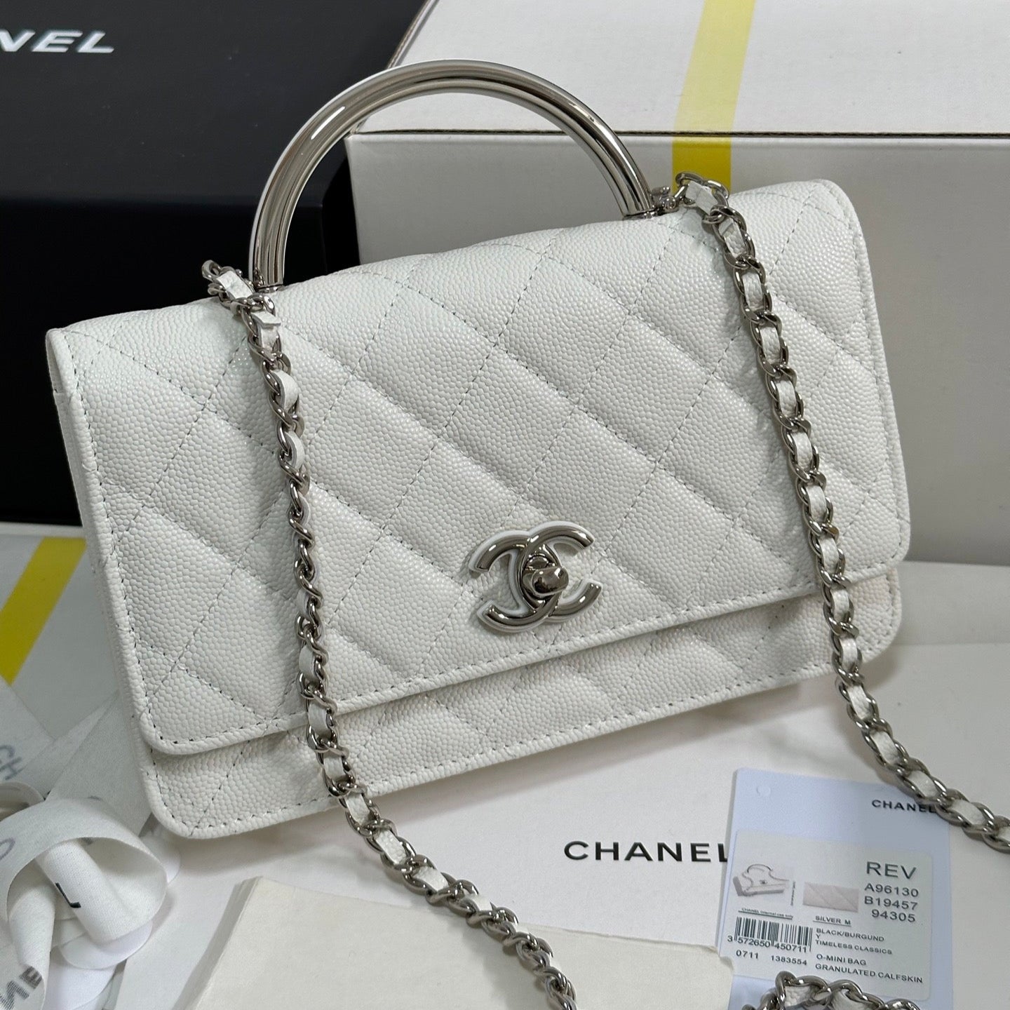 FLAP BAG WITH SILVER-TONE HANDLE 19 IN WHITE CAVIAR SKIN